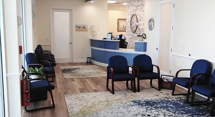 Dark blue chairs in waiting area of Beachside Smiles Pediatric Dentistry