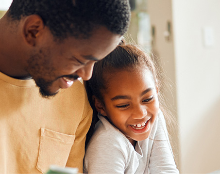 Father laughing with his daughter