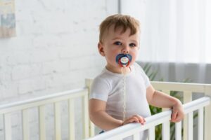 Baby sucking pacifier.