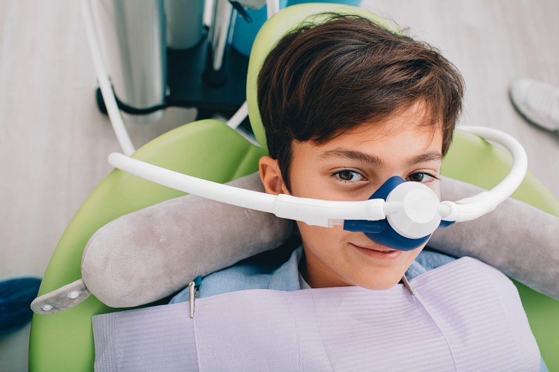 young boy wearing a nasal mask